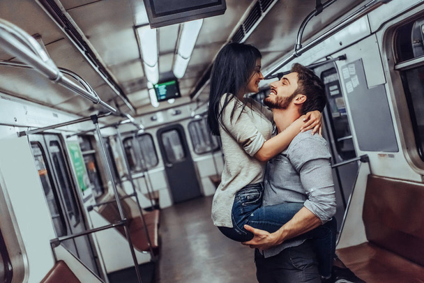 Young romantic couple in subway. Underground love story. - Zdjęcie, obraz