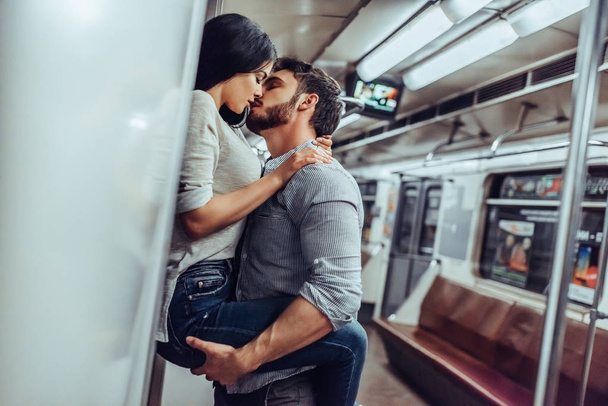 Young romantic couple in subway. Underground love story. - Foto, Imagem