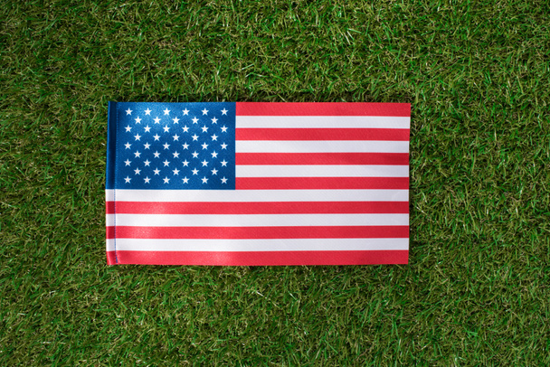 top view of american flag on green grass, 4th july holiday concept - Photo, Image