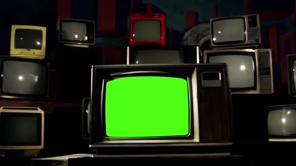 Ρετρό Tv πράσινη οθόνη με πολλά του 1980 τηλεοράσεις έτοιμο να αντικαταστήσει πράσινη οθόνη με οποιοδήποτε υλικό ή μια εικόνα που θέλετε. Μπορείτε να το κάνετε με την πληκτρολόγηση (Chroma Key) επίδραση στο Adobe After Effects. - Πλάνα, βίντεο