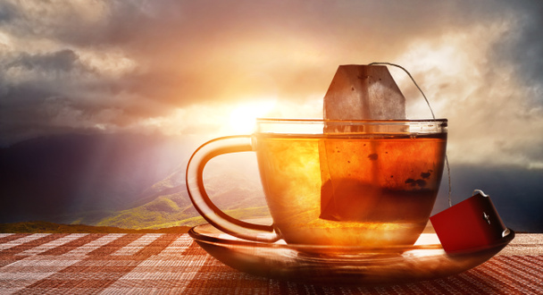 tasse de thé au coucher du soleil
 - Photo, image