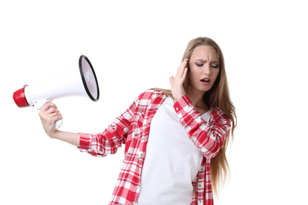 Young woman with megaphone on white background - Foto, imagen