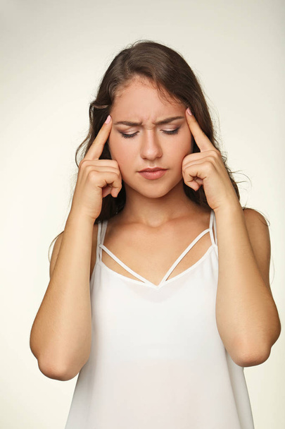 Beautiful young woman suffering from headache - Фото, зображення