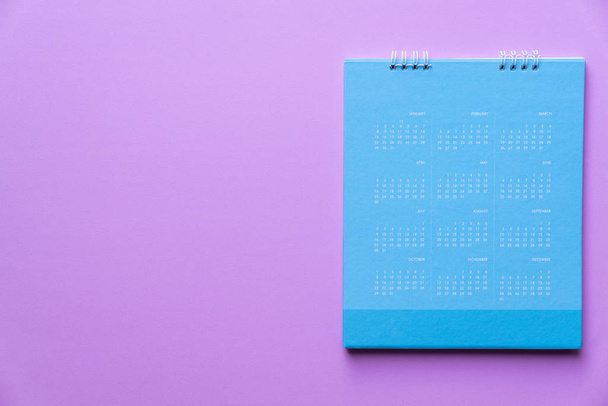 close up of blue calendar on pink background, planning for business meeting or travel planning concept - Foto, Imagem