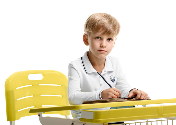 Schoolboy sitting at the desk - Zdjęcie, obraz