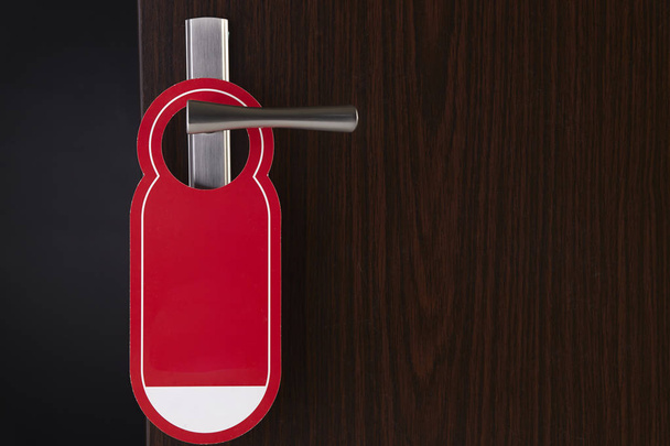 do not disturb red door sign hanging at door handle - Photo, Image