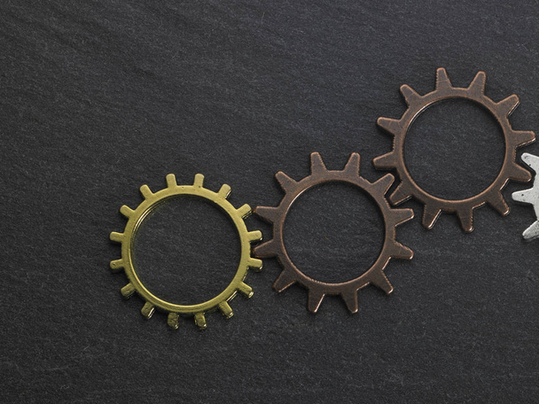 concept hour metal gears on dark background top view - Фото, зображення