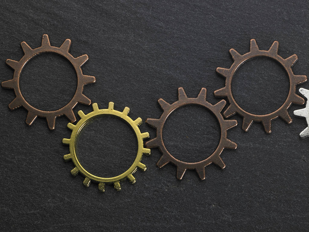 concept hour metal gears on dark background top view - Фото, зображення