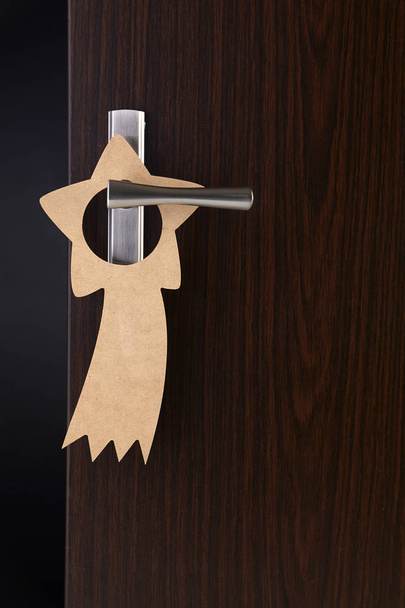 do not disturb beige door sign hanging at door handle - Photo, image