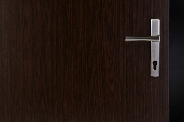 Modern, contemporary steal handle and keyhole detail - 写真・画像
