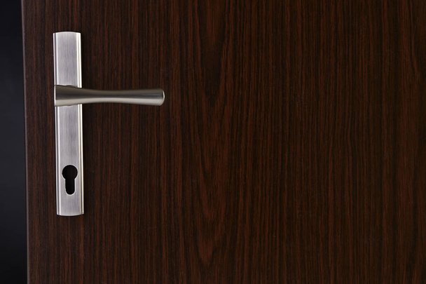 Modern, contemporary steal handle and keyhole detail - Фото, изображение