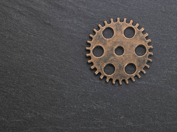 concept hour metal gears on dark background top view - Fotó, kép
