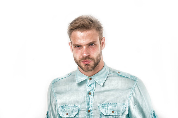 Bearded man with beard on unshaven face. Serious man in blue fashionable shirt isolated on white. Handsome and stylish. Hair and barber salon. Skin care and grooming. Casual in style, vintage filter - Фото, изображение