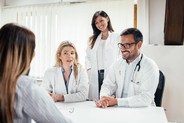 Team of doctors having meeting with a patient. - Photo, Image