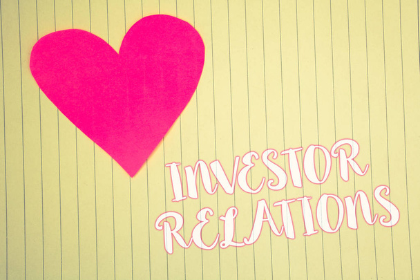 Word writing text Investor Relations. Business concept for Finance Investment Relationship Negotiate Shareholder Light pink heart symbol white paper backstage with outlines white letters - Photo, Image