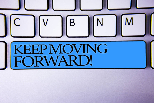 Handwriting text Keep Moving Forward Motivational Call. Concept meaning Optimism Progress Persevere Move Alphabetic buttons blue spacebar elementary part of computer keyboard - Photo, Image