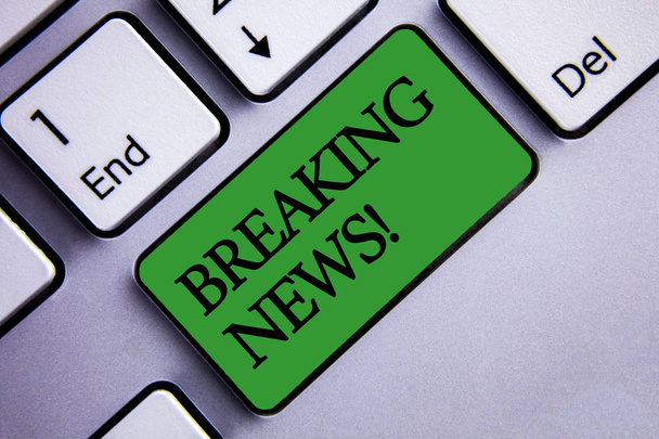 Text sign showing Breaking News Motivational Call. Conceptual photo Updated press report Latest information Text two words green insert button key press grey computer - Photo, Image