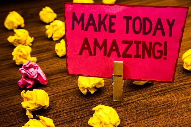 Conceptual hand writing showing Make Today Amazing Motivational Call. Business photo showcasing Productive Moment Special Optimistic Paperclip retrain pink card with letters wooden floor hunch - Photo, Image