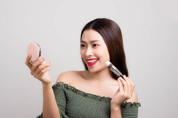 Closeup portrait of asian woman skincare wearing makeup on white background - Foto, Imagem