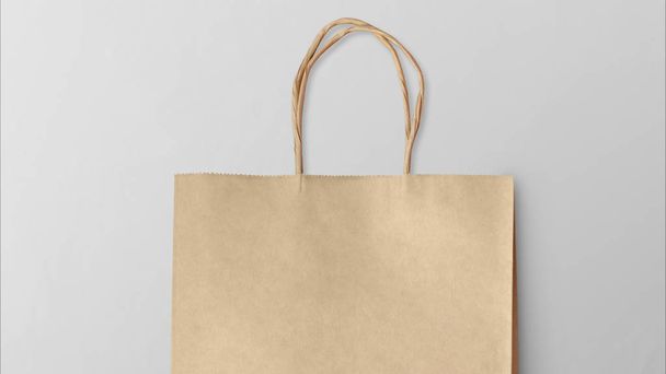 Bolsa de compras de papel aislada sobre fondo gris
 - Foto, imagen