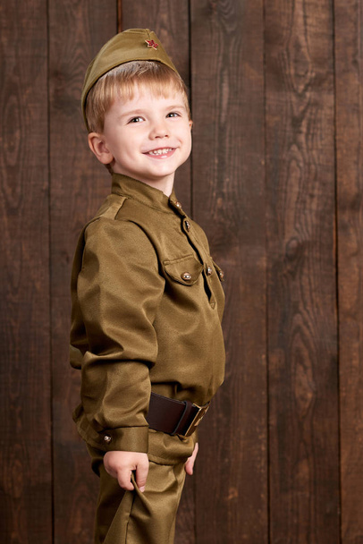 children are dressed as soldier in retro military uniforms - Photo, Image