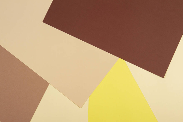 Color papers geometry composition background with brown, beige and yellow tones. - Fotoğraf, Görsel