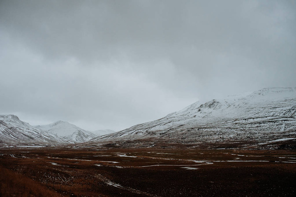 A landscape in Snaefellsnes, Iceland with snow covered mountains in the background. - 写真・画像