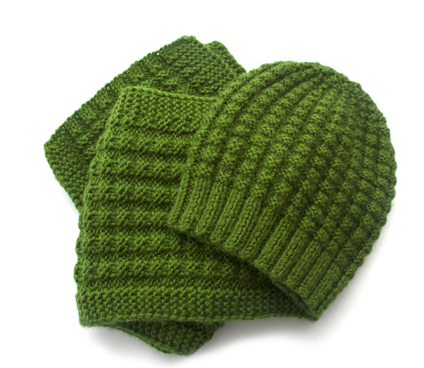 Knitted scarf and hat of dark green colour on a white background. - Photo, Image