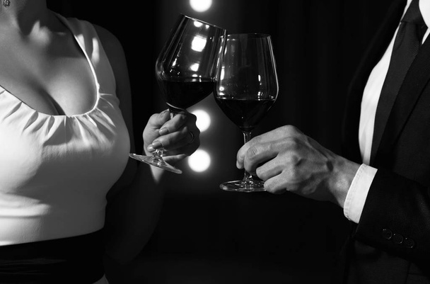 Celebrating mutual success. couple in love on romantic date with wine glasses - Foto, Bild