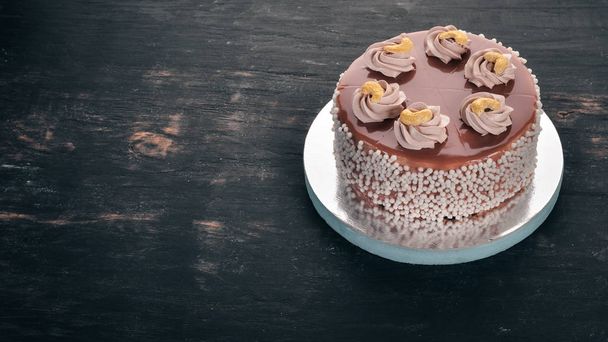 Chocolate cake. On a wooden background. Top view. Free copy space. - Zdjęcie, obraz