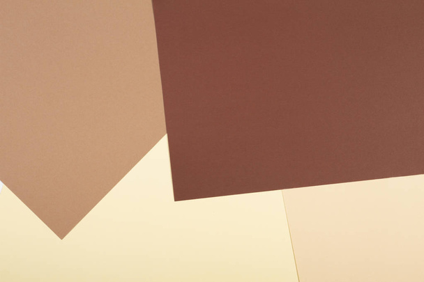 Цвет бумаги геометрический фон с коричневыми, бежевыми и желтыми тонами
. - Фото, изображение