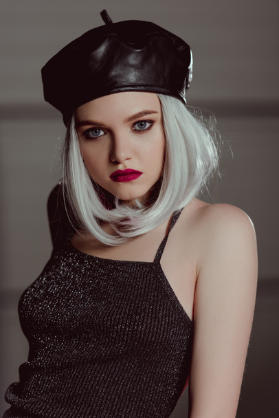 portrait of beautiful stylish blonde woman in black leather beret looking at camera - Foto, Imagen