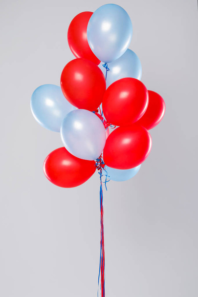 Many colorful balloons isolated on gray background - Zdjęcie, obraz