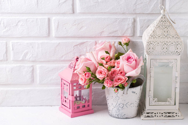 Pink roses flowers, heart  and decorative pink lantern against  white brick wall. Floral still life.  Selective focus. Place for text.  - Foto, immagini