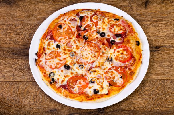 Pizza with bacon and tomato - Photo, Image