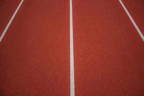 athletic track running brown road background texture concept with marking lanes and empty spacefor copy or text - Photo, Image