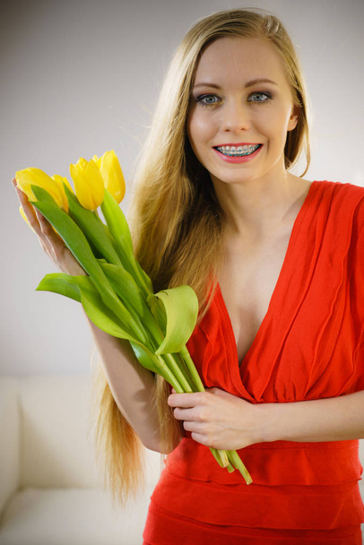 International women day, eight march. Beautiful portrait of pretty woman blonde hair with yellow tulips, fashion make up, elegant dress. Mothers day. - Foto, Imagem