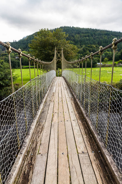 Suspension Bridge over the River Conwy, in Betws-y-Coed, Gwynedd, North Wales, UK - Photo, Image