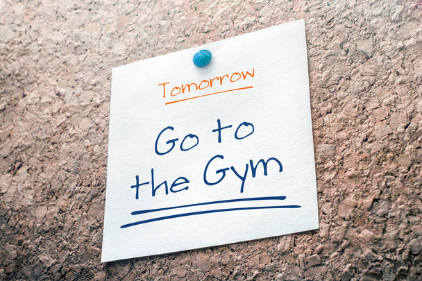 Go To The Gym Reminder For Tomorrow On Paper Pinned On Cork Board - Photo, Image