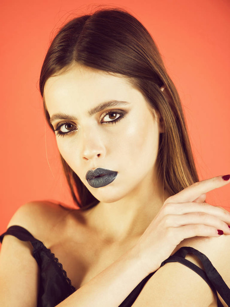 Caucasian female fashion model posing. girl with beautiful hairstyle has black makeup - Фото, зображення