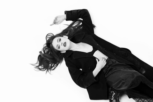 Female fashion concept. girl in black coat, beautiful portrait of woman on white - Foto, Imagem