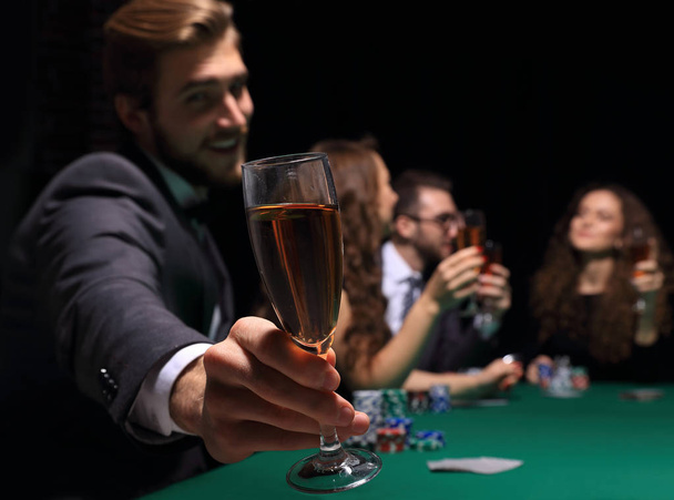 poker player with a glass of wine - 写真・画像