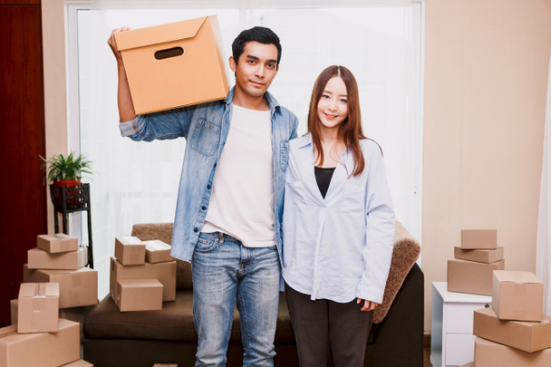 Young couple with cardboard box at home - Business online and delivery concept - Photo, Image
