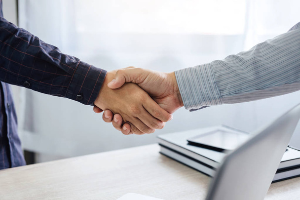 Business partnership meeting concept, Two confident Business handshake and business people after discussing good deal of Trading contract and new projects for both companies, success, partnership. - Fotoğraf, Görsel