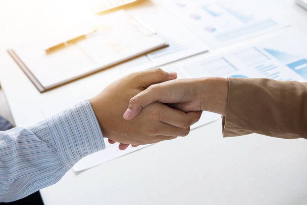 Business partnership meeting concept, Two confident Business handshake and business people after discussing good deal of Trading contract and new projects for both companies, success, partnership. - Foto, Imagem