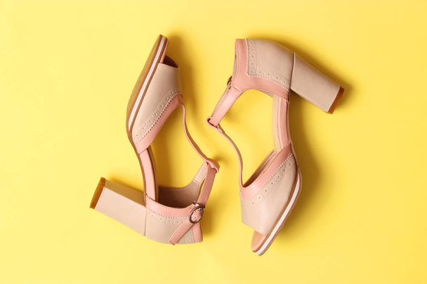female sandals on heel on a colored background top view. women's shoes - 写真・画像