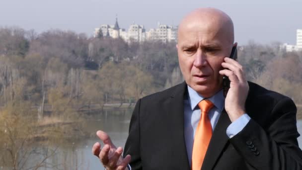 Troubled Concerned Businessman Using Mobile Phone Irritated Man Hears Bad News. - Кадри, відео