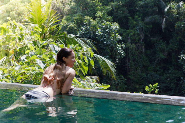 girl in the tropic jungle pool - Фото, зображення