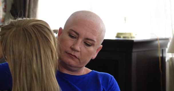 Portrait of a sad female cemotheraphy patient with wig and looking at the camera sadly. Breast cancer survivor - Záběry, video