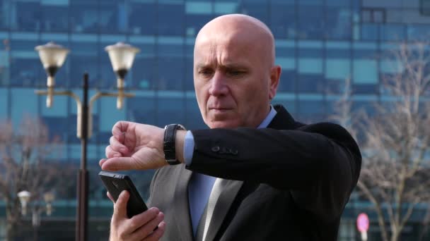 Businessman Checking Mobile Looking Wristwatch Call a Taxi with Hand Gesture. - Video, Çekim